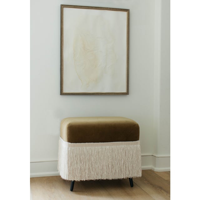 The Hutton is a cotton velvet upholstered stool, finished with a fringe trim in Dune. Crafted from richly variegated...