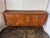 Solid oak sideboard with (4) locking cabinet doors with original hardware. There are (4) drawers below doors with carved...