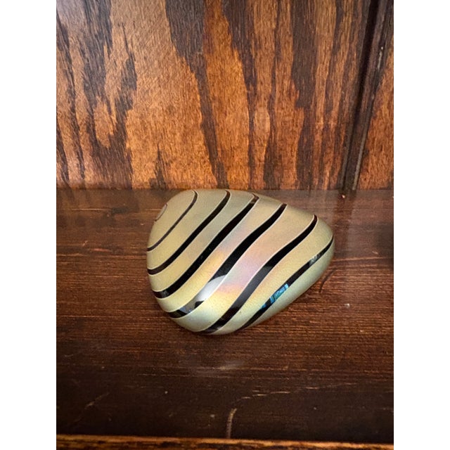 This listing features a pair of studio art glass paperweights, offered together as a set. While both pieces are signed and...