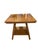 Solid oak side table featuring turned barley twist legs and a lower storage shelf. The warm oak finish and traditional...