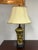 Design Plus Gallery presents a Vintage Table Lamp. This table lamp has a gold-tone ceramic vase-form body with black...