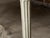 A pair of French Louis XVI period antique white painted console tables from the 18th century with marble tops, carved...