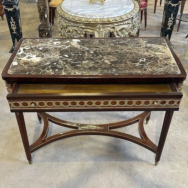 In love with the design. Fantastic table with a rectangular marble frame. Beautiful copper-colored table, it has a...
