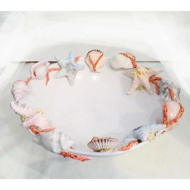 An extremely rare Italian beautiful large ceramic decorative bowl adorned with various types of seashells by I borbone...