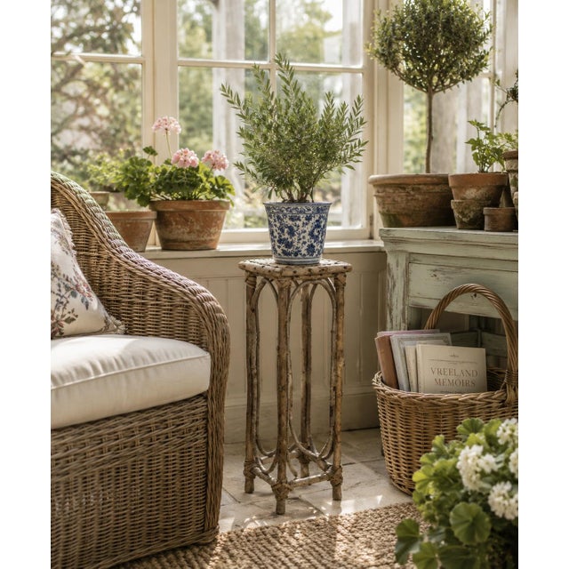 A wonderfully slender American side table constructed from natural branches and bent twigs, with a woven stick top and...