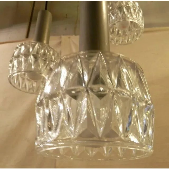 Vintage modern hanging lamp with three cut glass shades, descending lengths that can be adjusted. Condition Good. Re-...