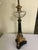 French Empire Neoclassical Table Lamp Beautiful black and gold with clear glass topper On a gold gilt with 3 claw feet On...