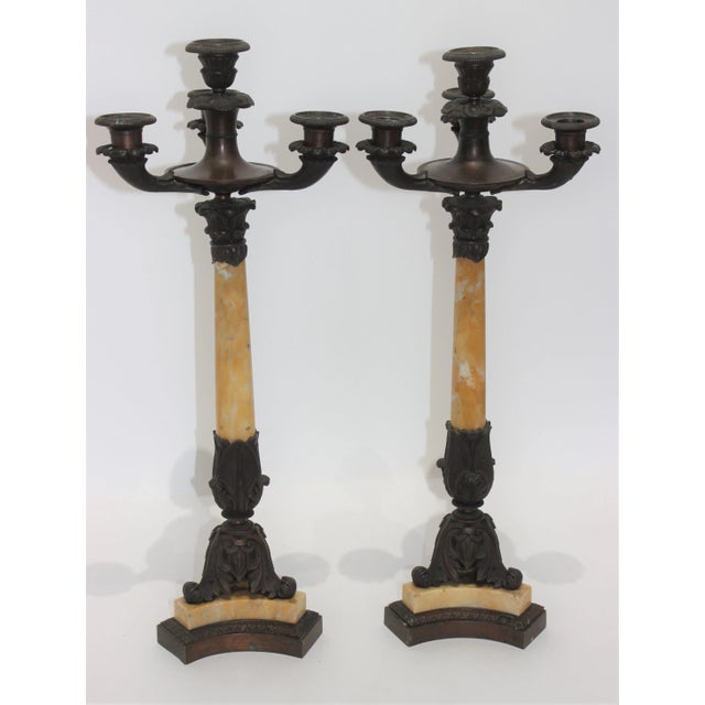 This stylish and chic pair of Charles X candlesticks will make a statement with their form and use of materials.