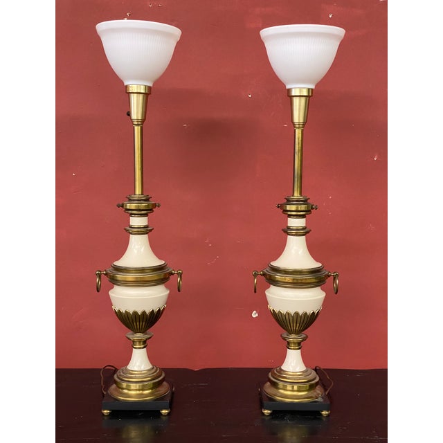 As found condition. They look good but could use some polishing/cleaning. One lamp has a few small chips in the...