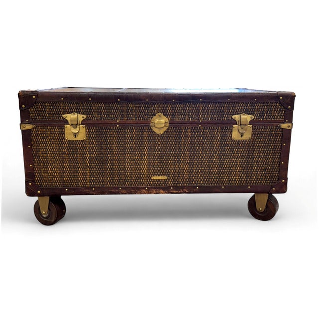 Baker Milling Road Campaign Style Trunk Table. Wrapped in woven rattan with croc embossed leather top, leather handles and...