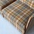 c. 1970s. Italy. Reupholstered in plaid fabric with leather trim. This piece is attributed to the mentioned...