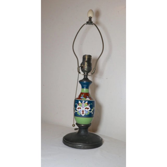 Up for sale is a rare antique Austrian Amphora pottery and cast iron electric table lamp. There shaft is done out of...