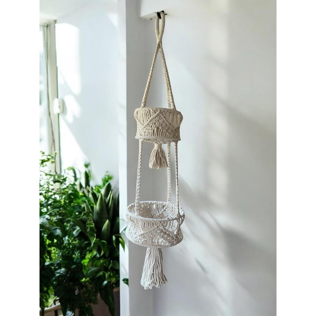 Handwoven vintage macrame tiered plant holder. Neutral cotton yarn in geometric design. 40” long including tassel x 4”...