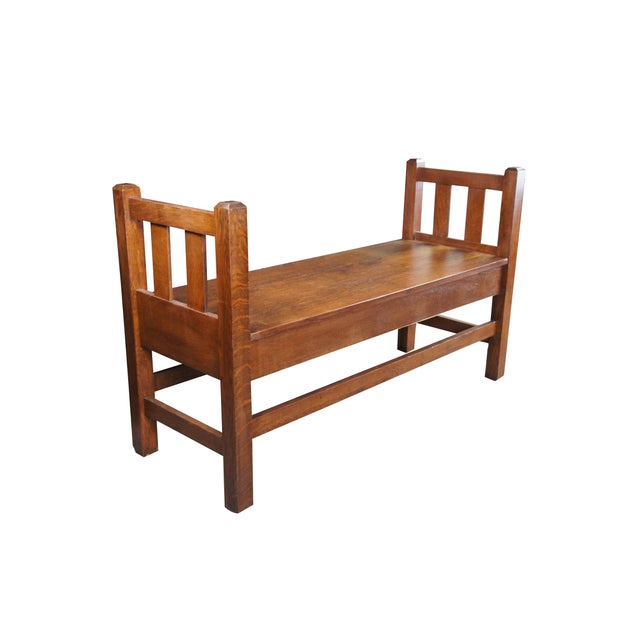 Antique storage bench featuring traditional Mission / Arts & Crafts styling with slatted sides and large hinged...