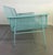 A striking mid-century modern metal mesh settee featuring a sculptural silhouette and airy architectural form. Constructed...