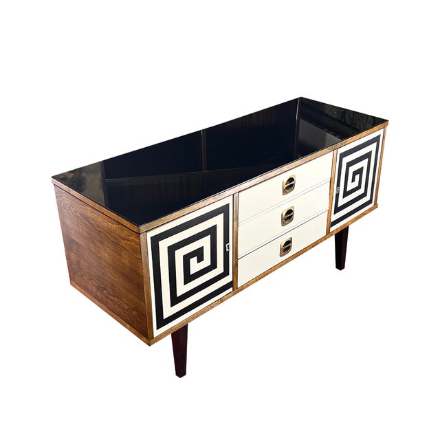 This chest of drawers was manufactured in Czechoslovakia in 1973. Restored walnut veneer on the sides, finished with a...
