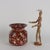 Vienna porcelain vase with vegetal spiral decoration and scattered flowers on a burgundy background. Expanded rim and...