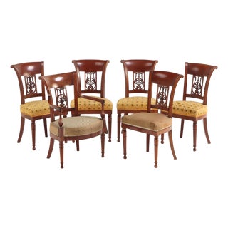 A Set of Six French Directoire Style Carved Walnut Dining Chairs, 19th Century. For Sale