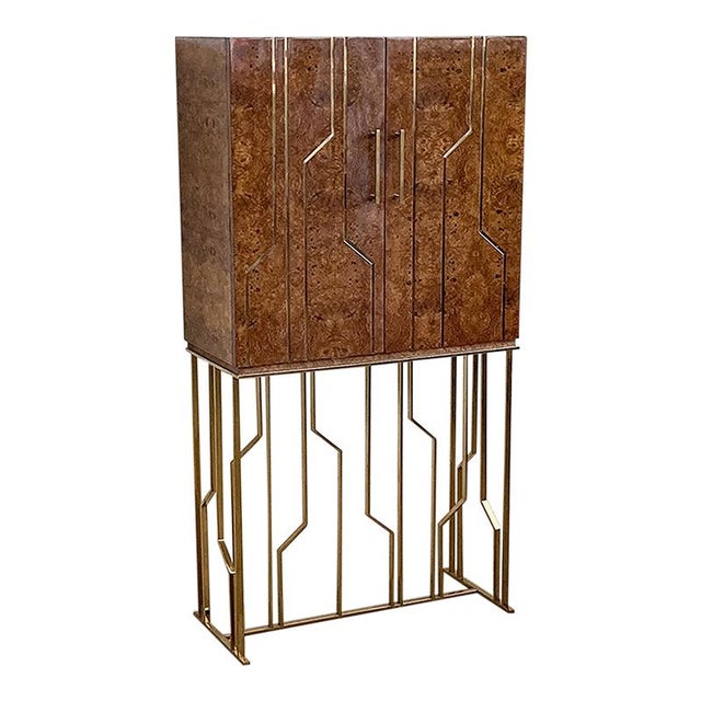 Briarwood bar cabinet with brass tubular base , two doors and an interior drawer. Mirrored interior. Dimensions (lxpxh) cm...