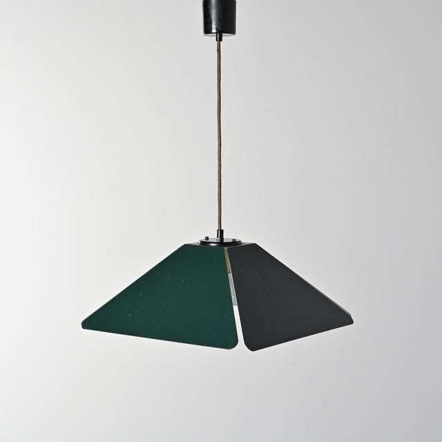 Rare pendant light selected by Charlotte Perriand for Les Arcs. It was produced by Staff Milano and designed by Alex...