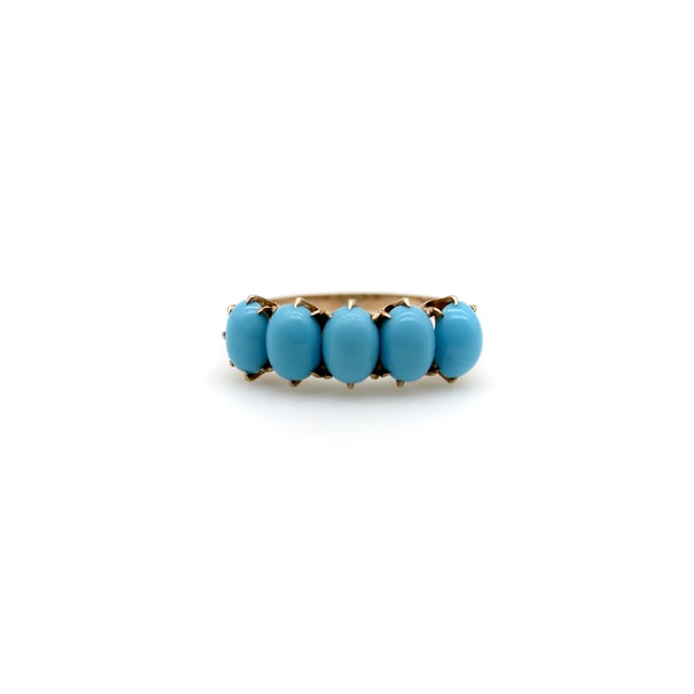 This is a classic 10k gold Victorian five-stone ring that features a row of turquoise cabochons. The well-matched stones...