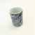 A vintage 1980s postmodern ceramic tumbler. Features an abstract design to the surface in gray with colorful accents....