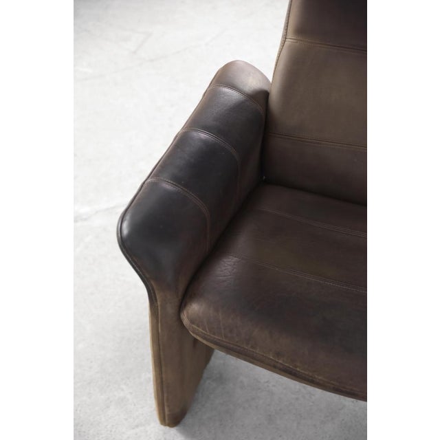 This vintage executive lounge armchair was manufactured in Switzerland by De Sede, during the 1970s. It is a model DS-50....