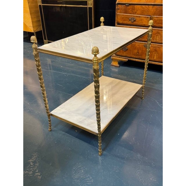 Maison Bagues manner gilt bronze and Carrara marble side table. You're eyeing a piece that radiates refined glamour—Maison...