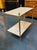 Maison Bagues manner gilt bronze and Carrara marble side table. You're eyeing a piece that radiates refined glamour—Maison...