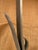 Wall-mounted iron base marble top console table. Elegant scroll base with warm-toned, salmon-colored marble top. Overall...