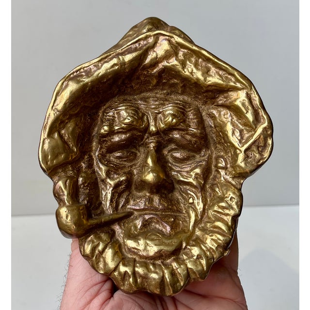 A vintage 1967 brass ashtray by the michigan artist miner “mike” keeler. A partially sculpted heavy-cast piece with...