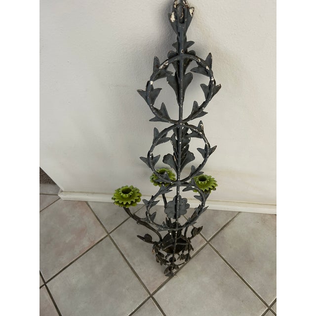 Late 19th Century Wrought Iron and Tole Wall Sconce. European. Measuring 36 inches tall, and 14 inches at widest point,...