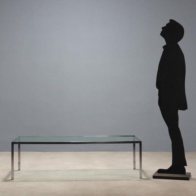 Vintage coffee table with chromed metal frame and rectangular glass top. This piece is attributed to the mentioned...