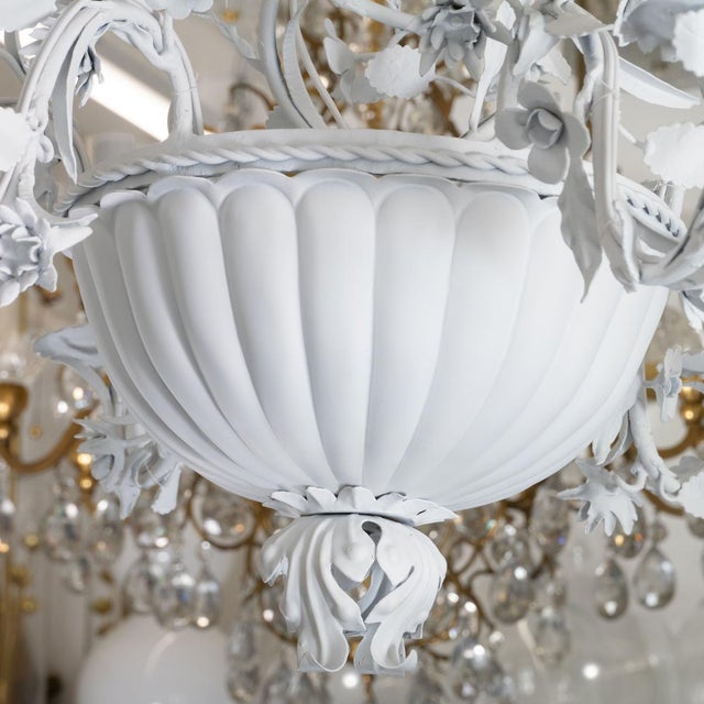 Enameled metal chandelier with foliate motif of vines and flowers.