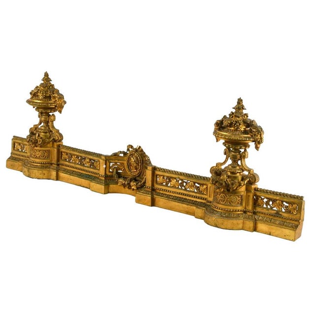 An elegant example of late nineteenth-century French decorative arts, this antique Bar de Cheminée fireplace fender...