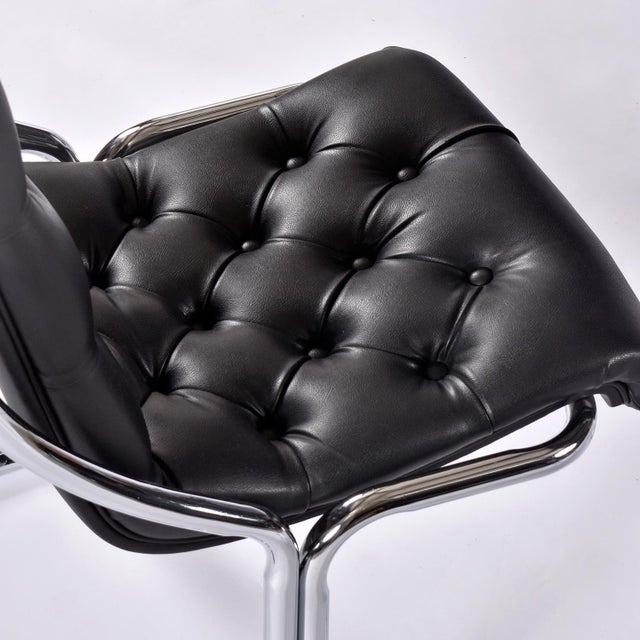 Vintage 1970s scoop chairs by Daystrom. The tufted black vinyl upholstery is original and in outstanding condition. Chrome...