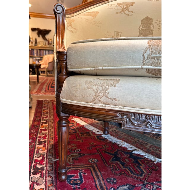 French Louis XVI Style Bergere Armchair. French Bergere armchair with dark wood frame, rounded back and reeded legs is...