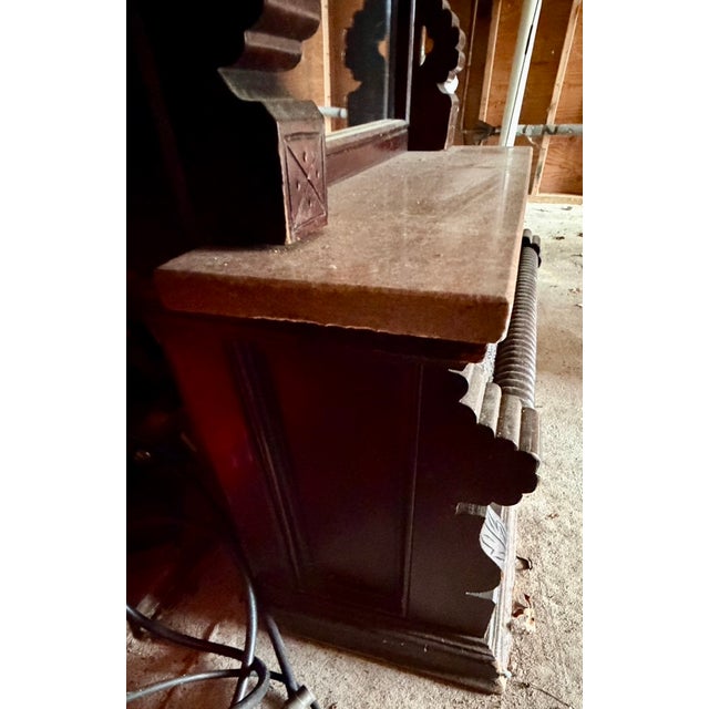 Antique Eastlake Victorian pier mirror, constructed from mahogany or walnut, featuring a marble top ledge. These mirrors...
