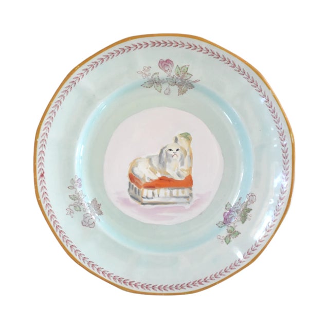 This is a portrait of Fitz, an antique English Staffordshire Poodle with confetti fur on an orange cushion. He would have...