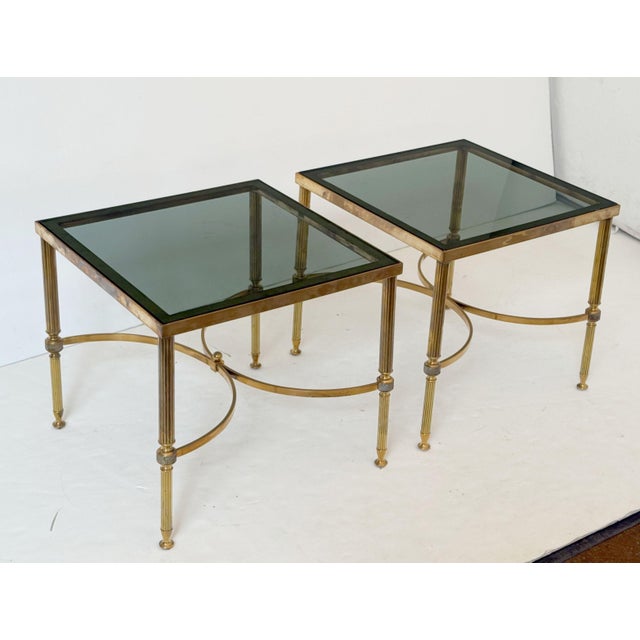 A pair of fine French Modern low square end or coffee tables in a Maison Jansen style - each featuring an inset smoked...