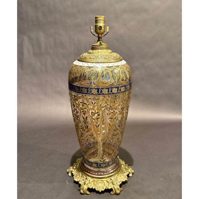 An extraordinary, museum-quality Islamic Revival table lamp, featuring an enameled glass body by the premier German glass...