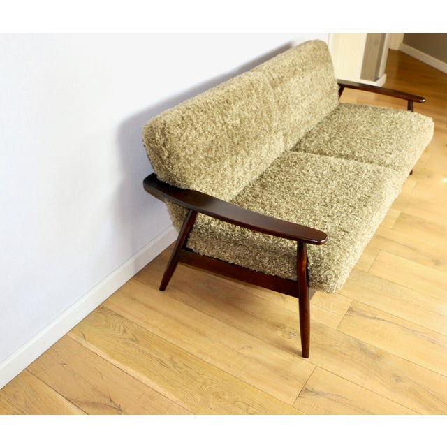 Beautiful vintage three-seater sofa from the 80s with removable cushions. Features long pile fabric in khaki and dark...