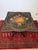 A beautiful vintage hand-painted floral tilt-top table featuring an ebonized finish, intricately painted floral bouquet,...