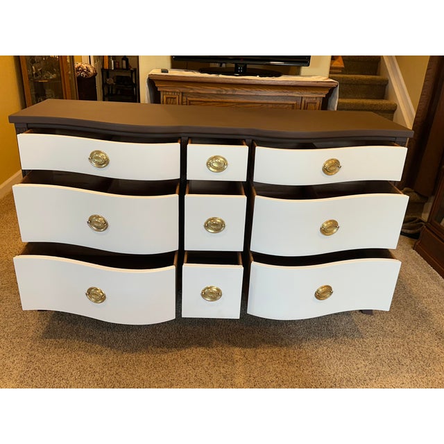 A striking mid-century classic, Drexel Travis Court Dresser. This vintage 1940s–1950s nine-drawer dresser is crafted by...