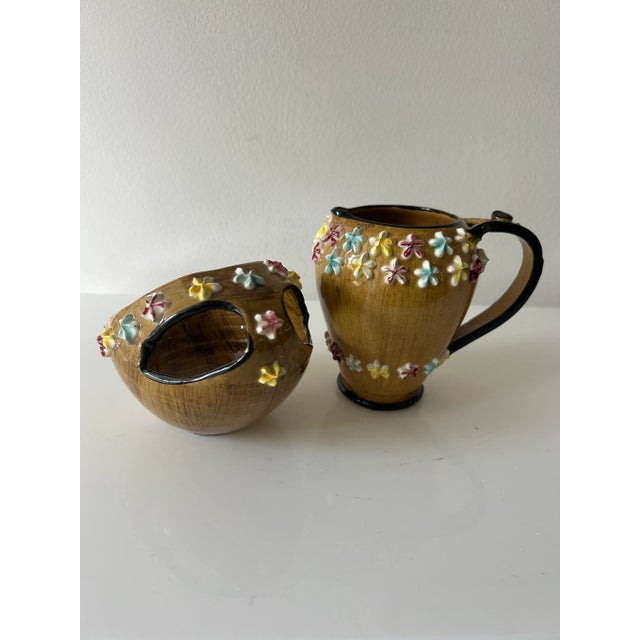 Vintage Italian Fratelli Fanciullacci Elbee ceramic creamer & sugar. Brown glaze with colorful applied flowers. Vintage...