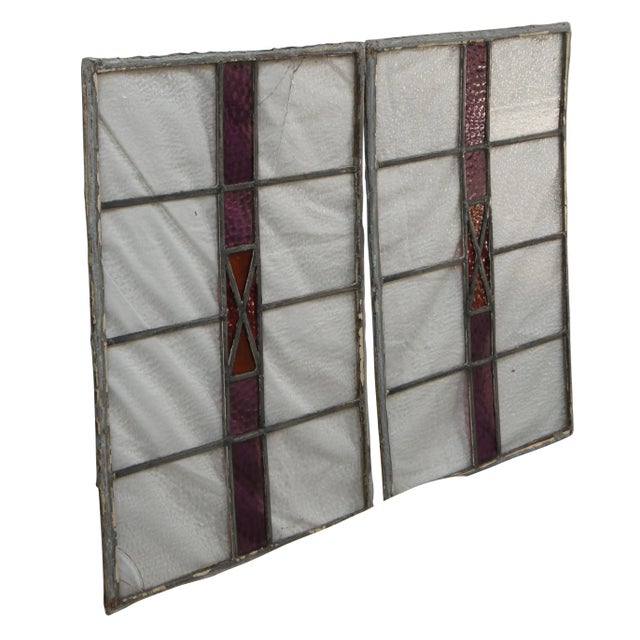 Pair of Antique Victorian Leaded Stained Glass windows. Features a gridded pattern with an amethsyt stripe and X pattern...