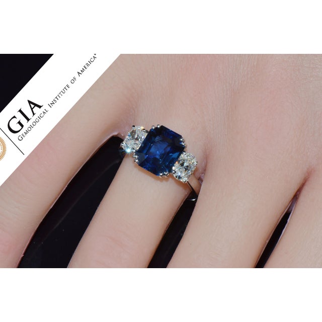 GIA certified 5.11CTS diamond and sapphire three stone solid 950 platinum ring. This ring features a huge GIA certified...