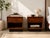 A striking pair of vintage Danish Modern nightstands by Dyrlund, crafted in Denmark and showcasing the clean architectural...