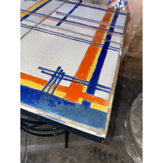 This is an amazing tile table from the 1920s made by D and M title company. It is very rare to see this type of pattern...