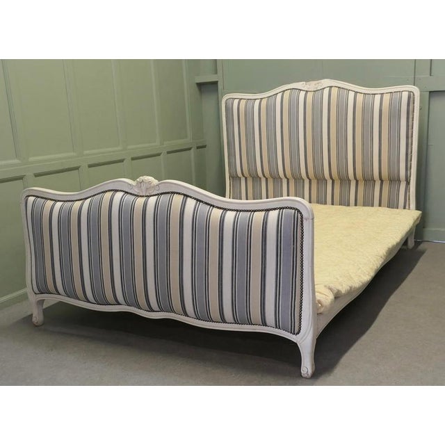 French Upholstered Double Bed The Head and foot boards of this bed have a carved waved top rail, the bed comes newly...